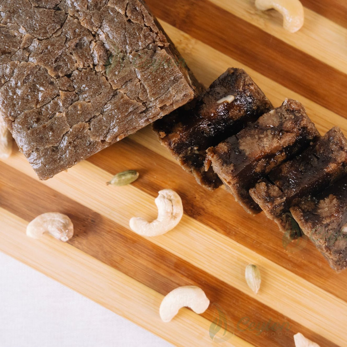 Top view of Crust Dodol with cashew nuts on a wooden board
