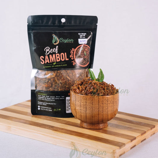 Ceylon Mood Beef Sambol pack with a wooden bowl of sambol on a wooden board