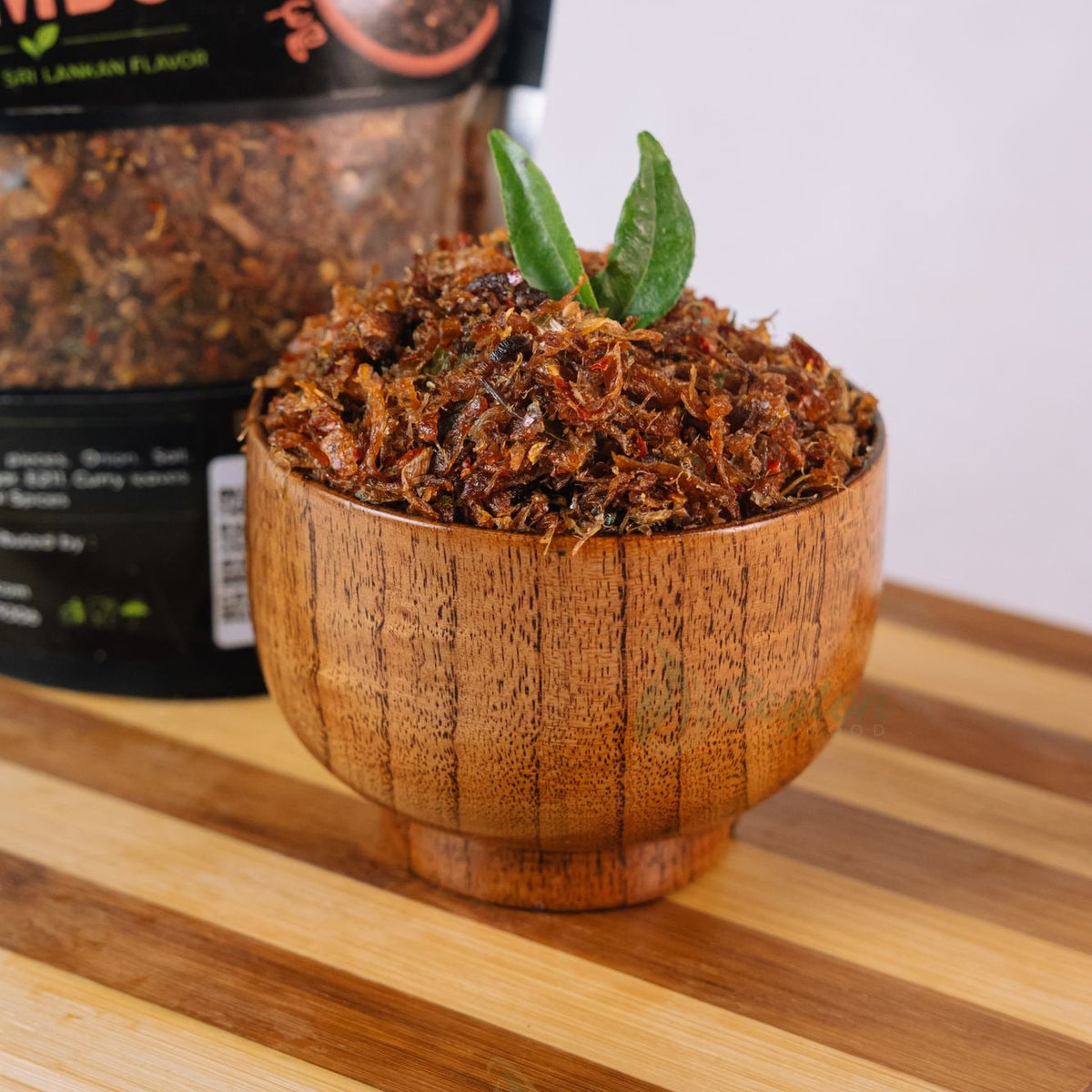 Close-up of crispy Sri Lankan beef sambol in a wooden bowl