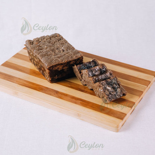 Crust Dodol with Cashew sliced on a wooden board, Ceylon Mood