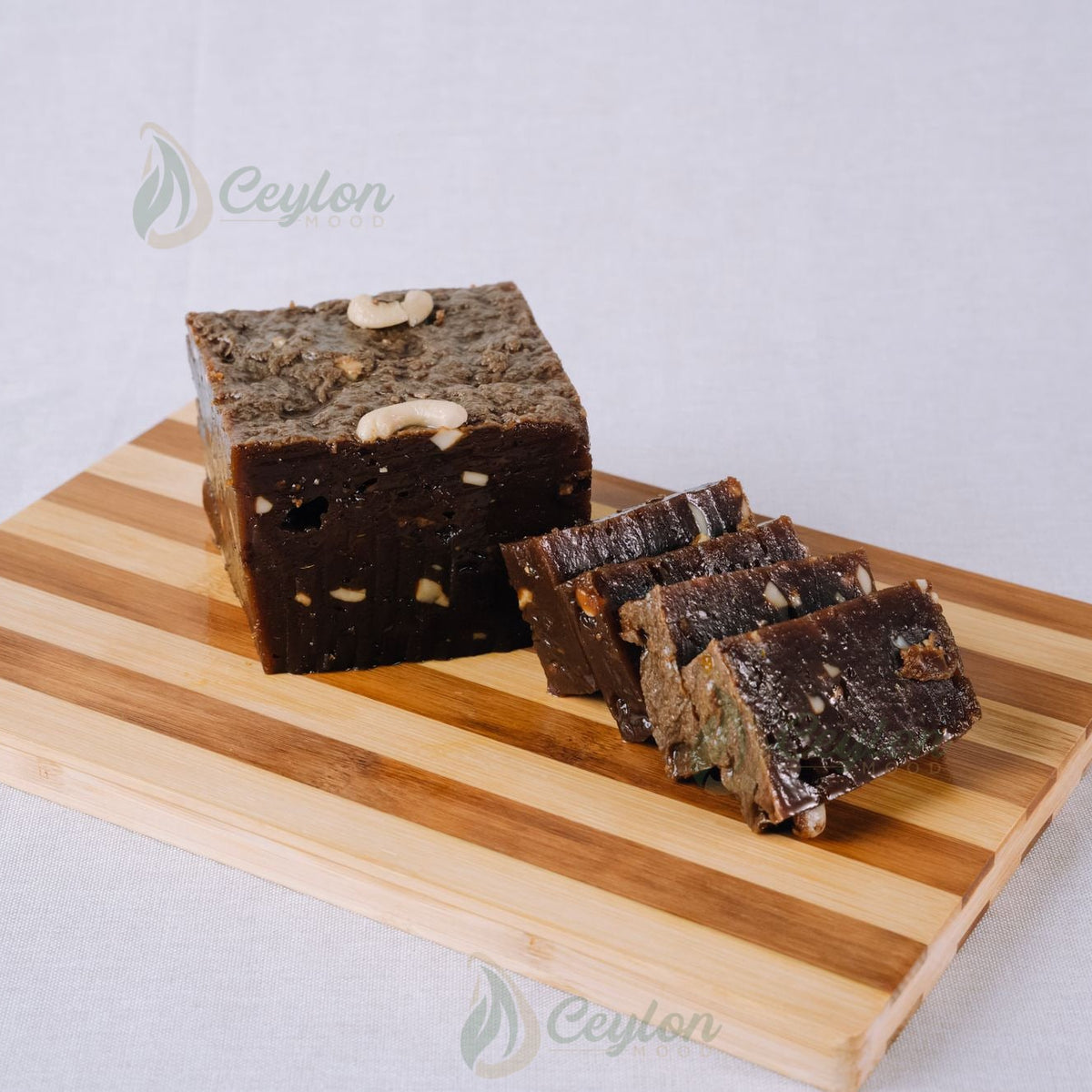 Kalu Dodol with Cashew block and slices on a wooden board, Ceylon Mood