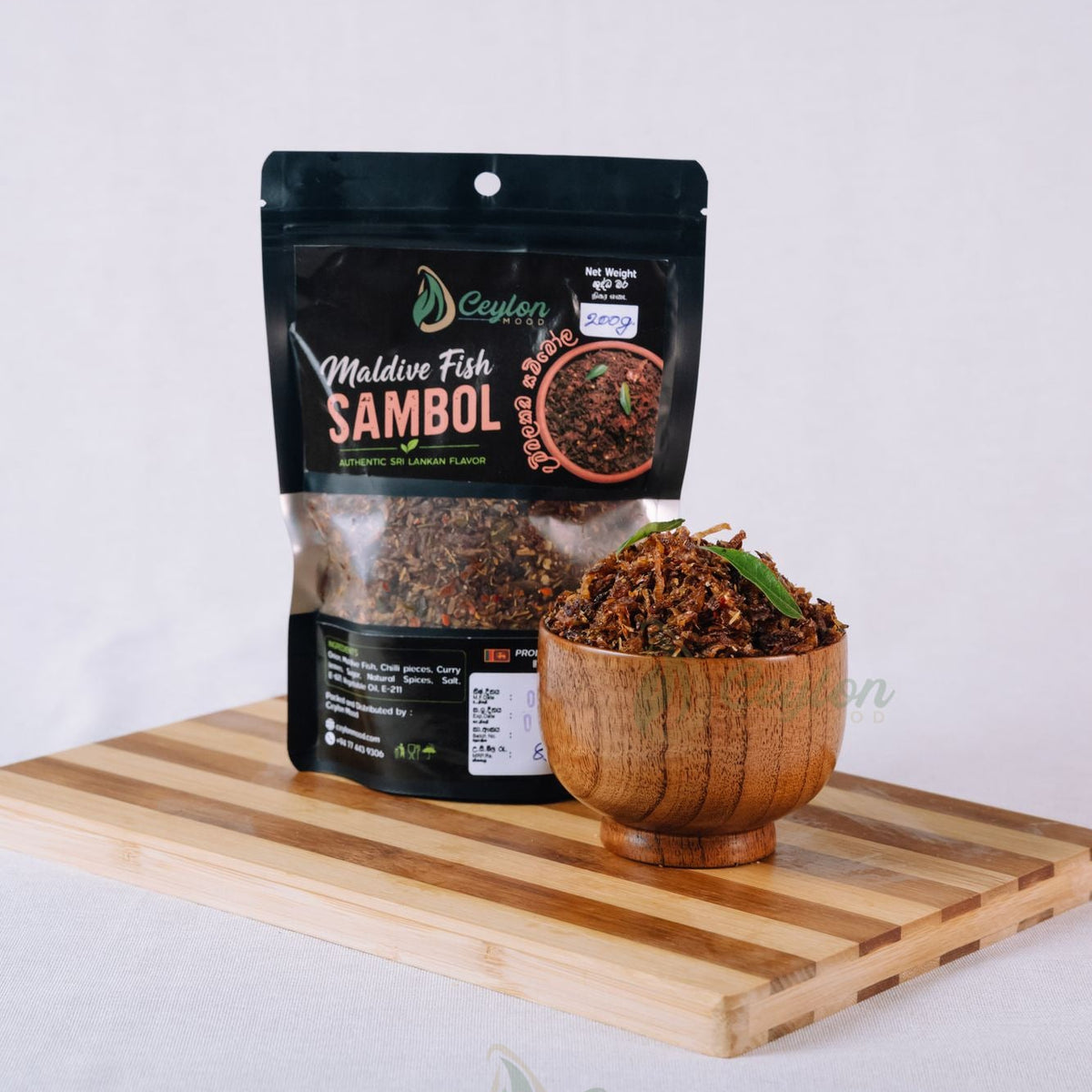 Ceylon Mood Maldive Fish Sambol pack with a wooden bowl of sambol on a wooden board