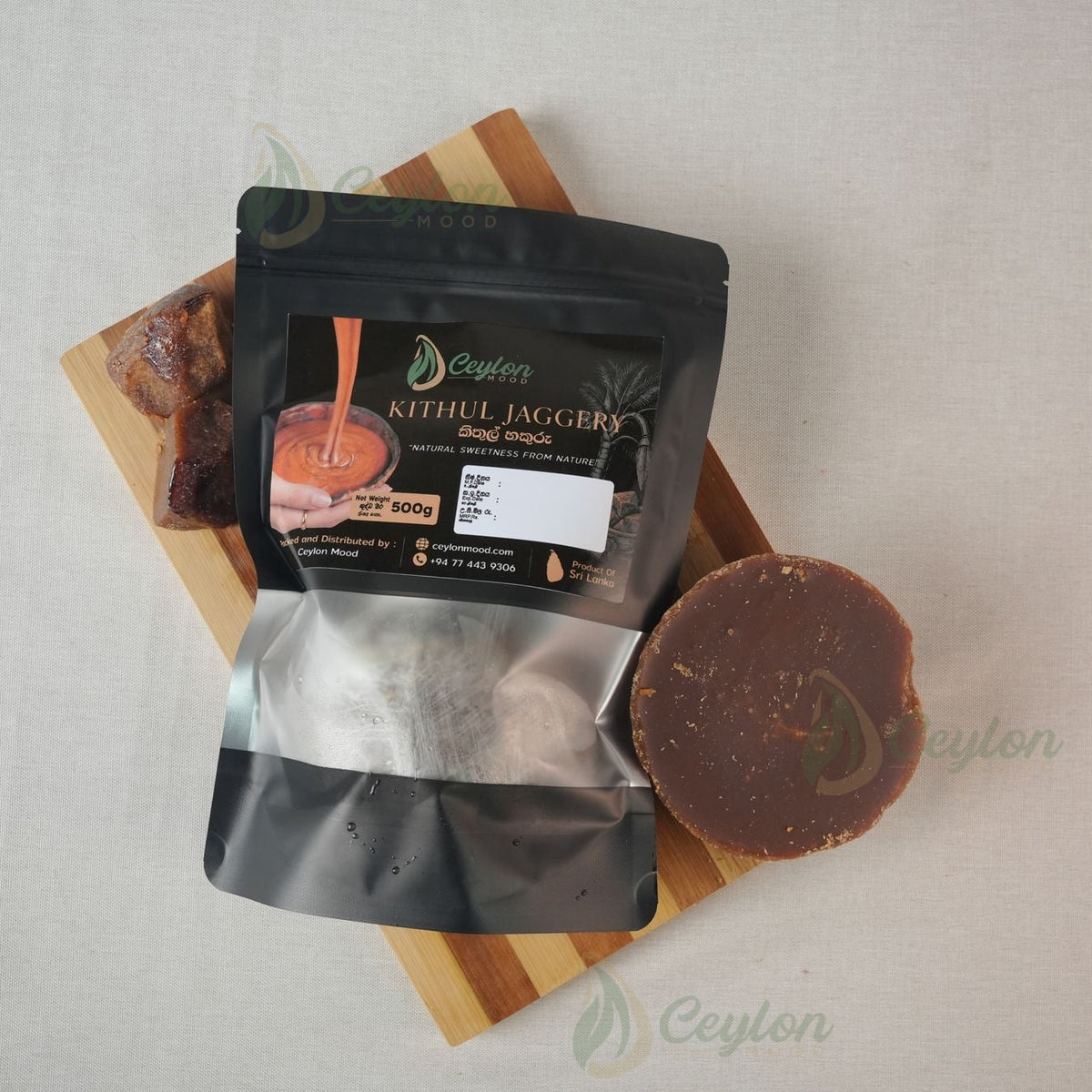 Top view of Pure Kithul Jaggery pack and jaggery piece on a wooden board