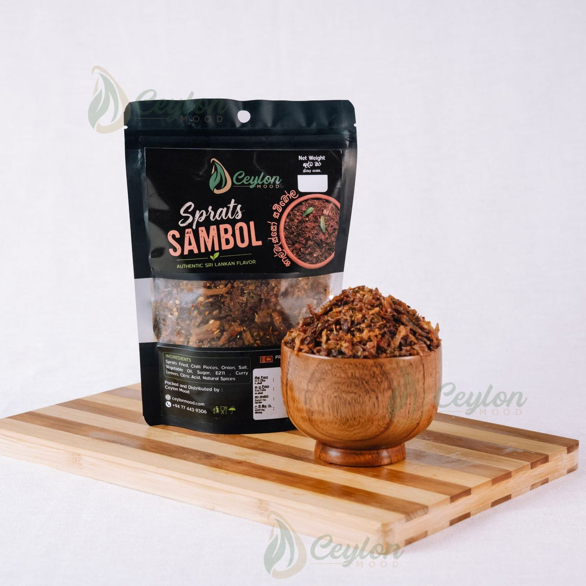 Ceylon Mood Sprats (Haalmasso) Sambol pack with a wooden bowl of sambol on a wooden board