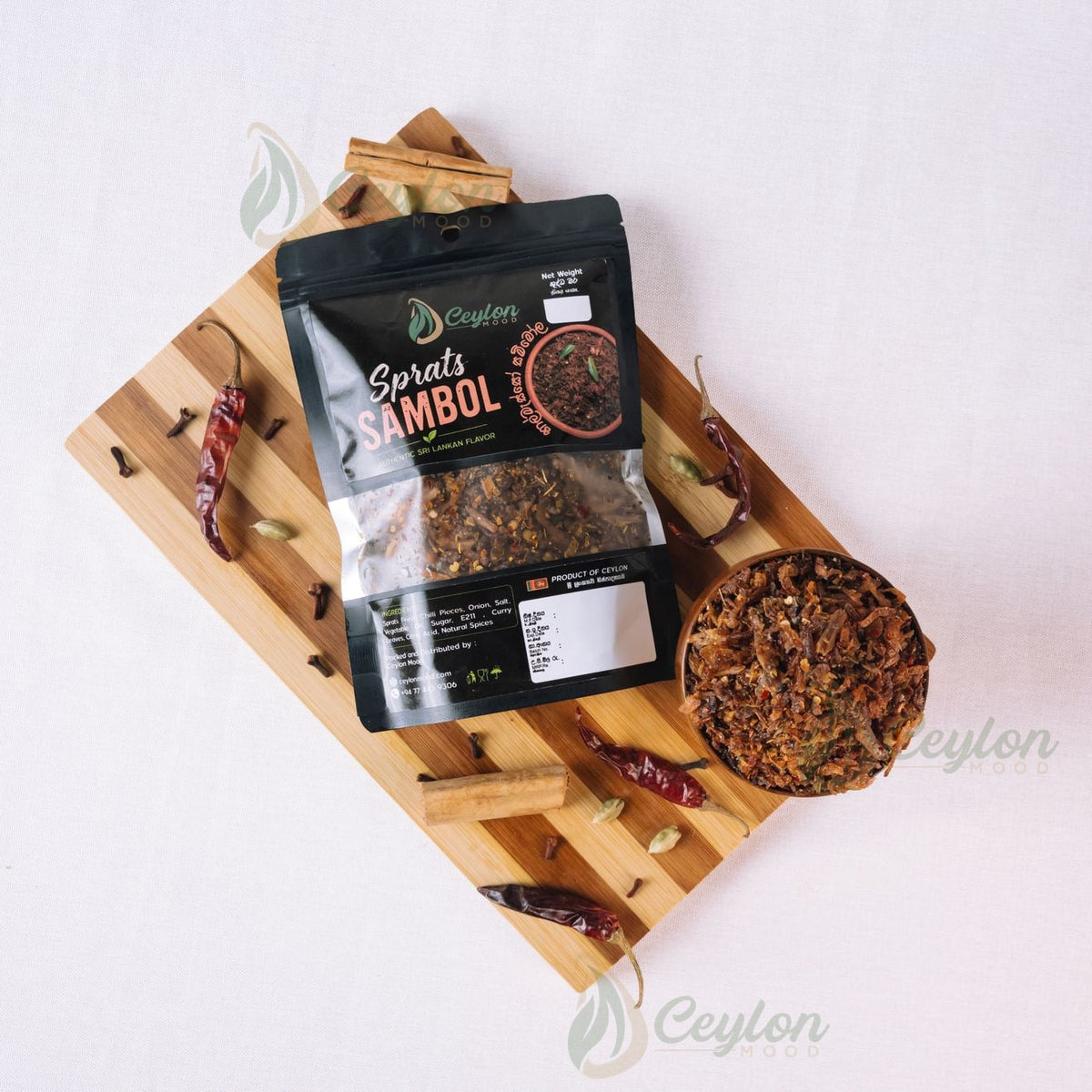 Top view of Sprats Sambol pack and bowl with spices on a wooden board